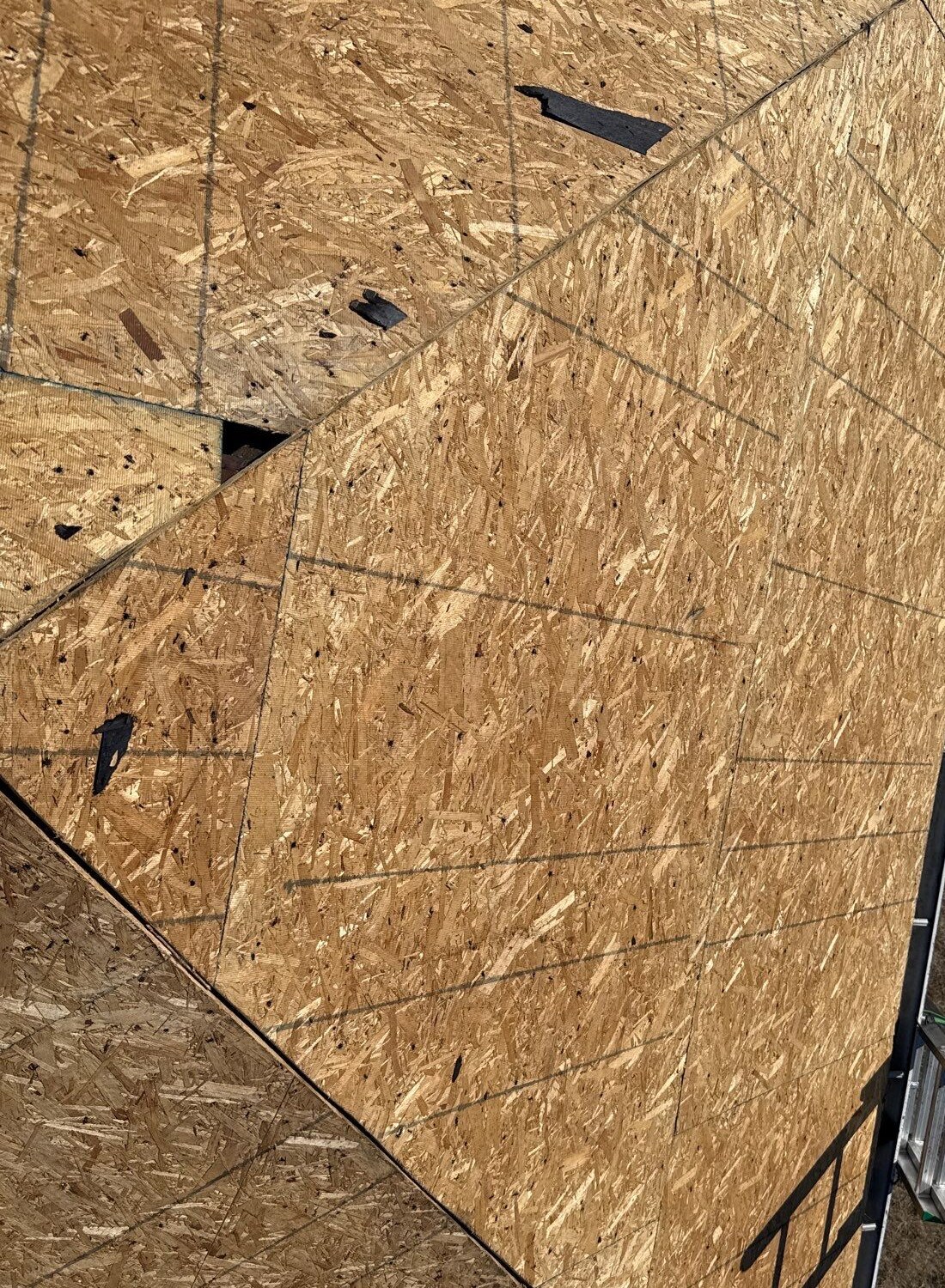 Exposed wood roof decking during roof replacement work