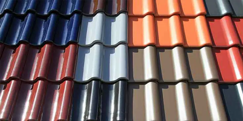 Rows of tile roofing profiles in several colors displayed side by side
